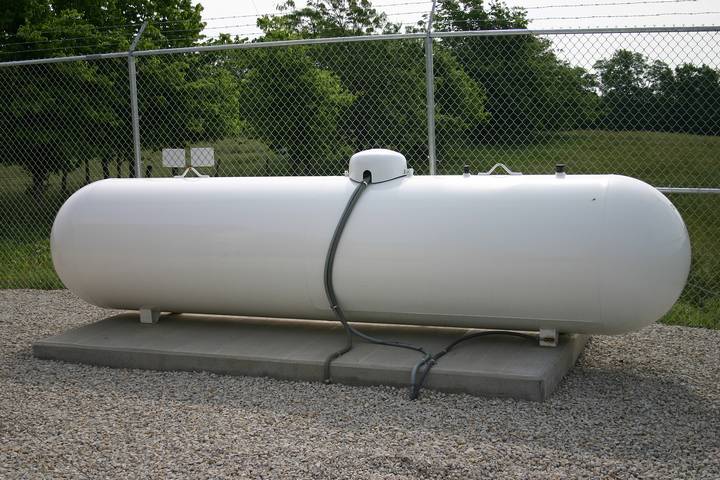 Proper propane tank placement should be on a flat, stable surface, away from flammables, sparks, and flames.